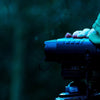 Nightfox 100V Night Vision Binocular being used in a tripod | Side angle