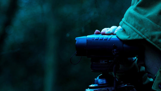 Nightfox 100V Night Vision Binocular being used in a tripod | Side angle