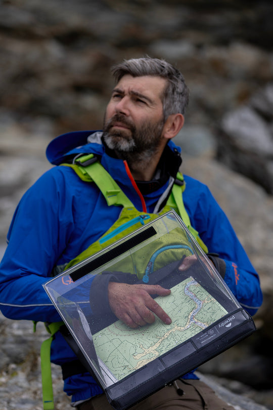 Using a waterproof clipboard in a rocky environment